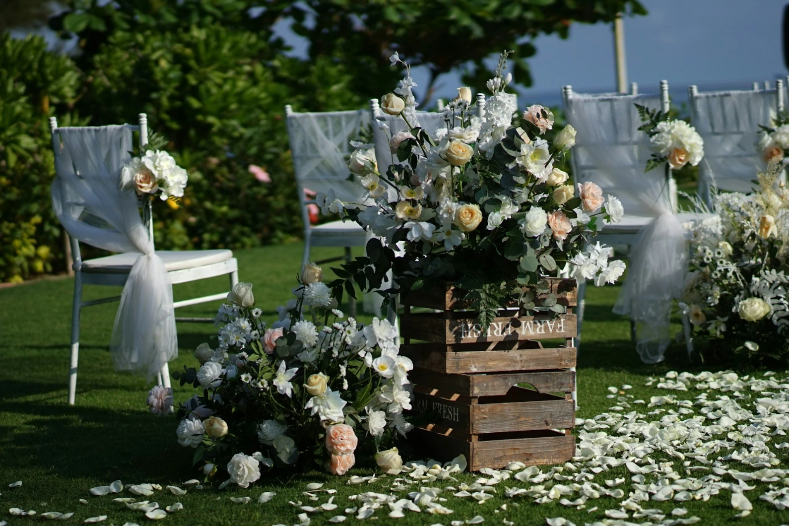 white and green flowers on brown wooden crate